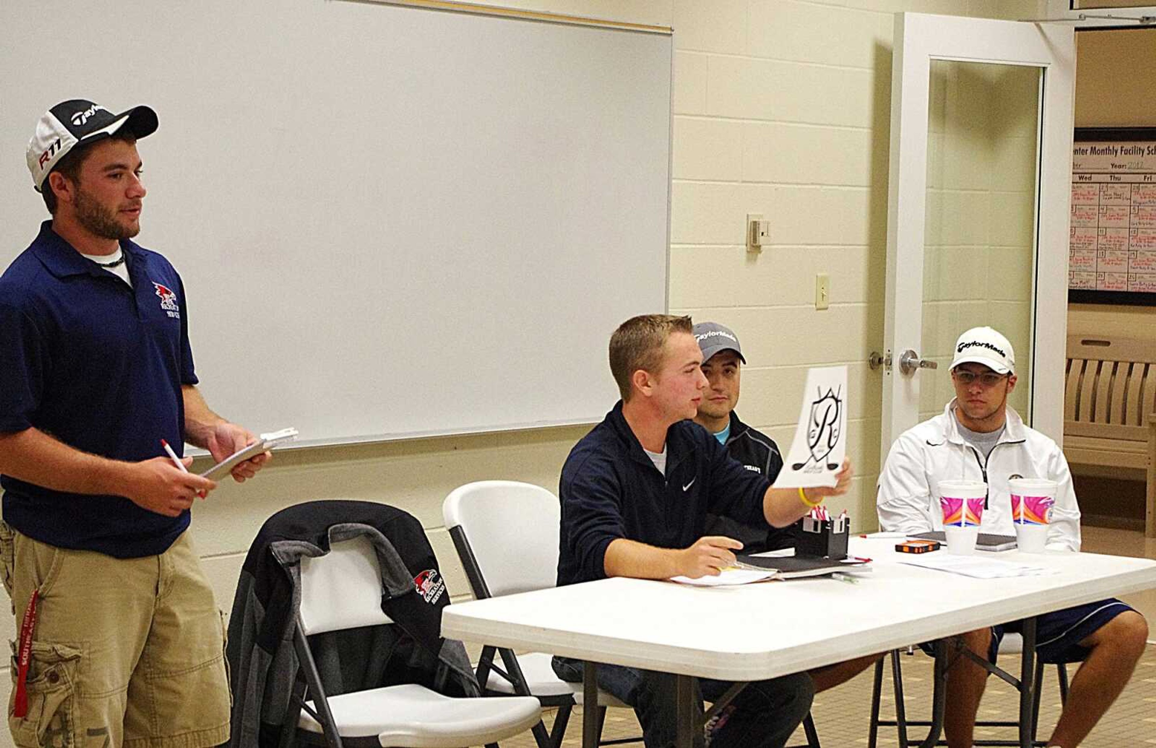 Founders of the golf club talk to students who are interested in joining during their first meeting on Oct. 3 in the Student Aquatics Room at the Student Recreation Center-North. Photo by Nathan Hamilton