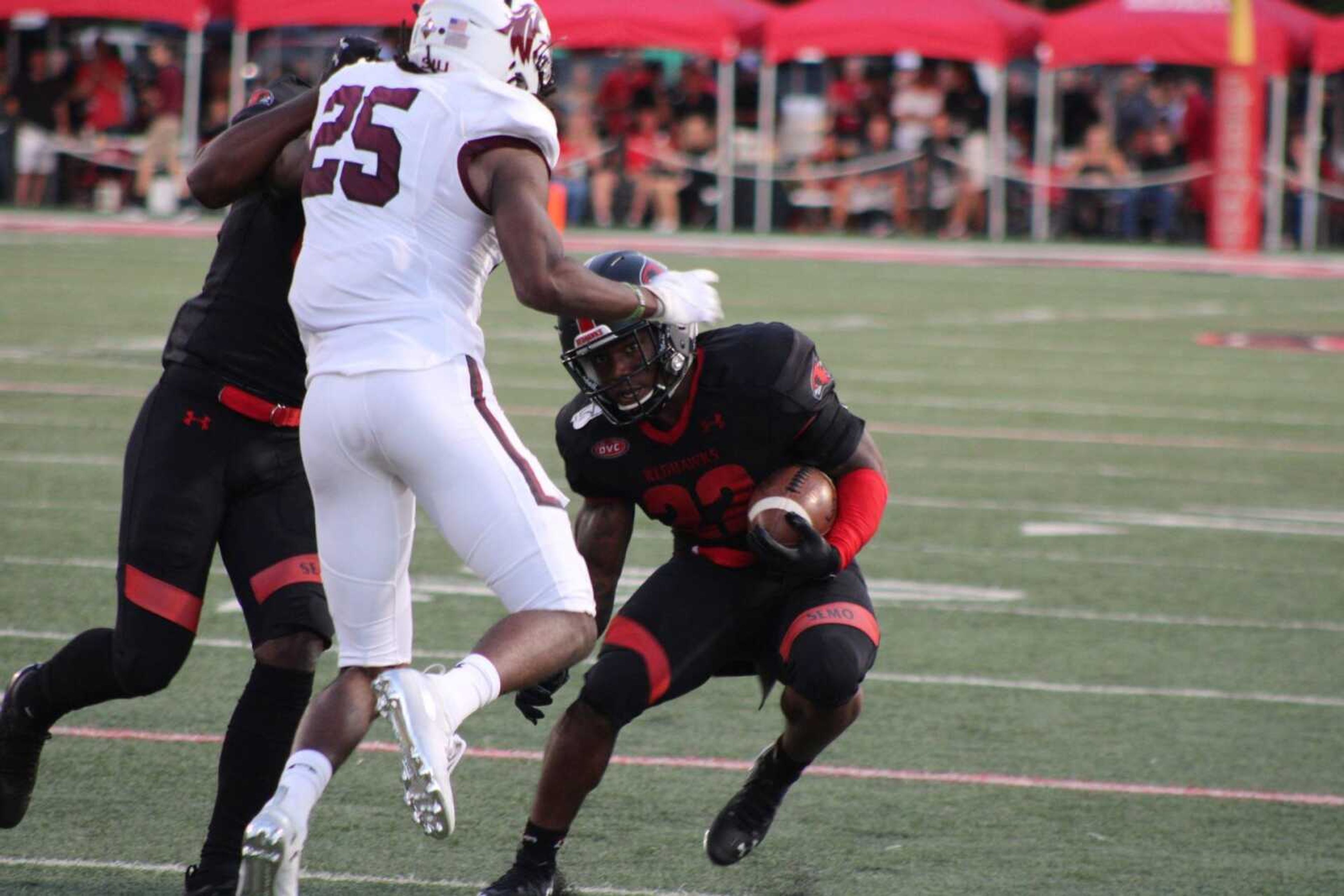 Redhawks sophomore running back Zion Custis makes a juke move to pick up additional yardage against Southern Illinois. 