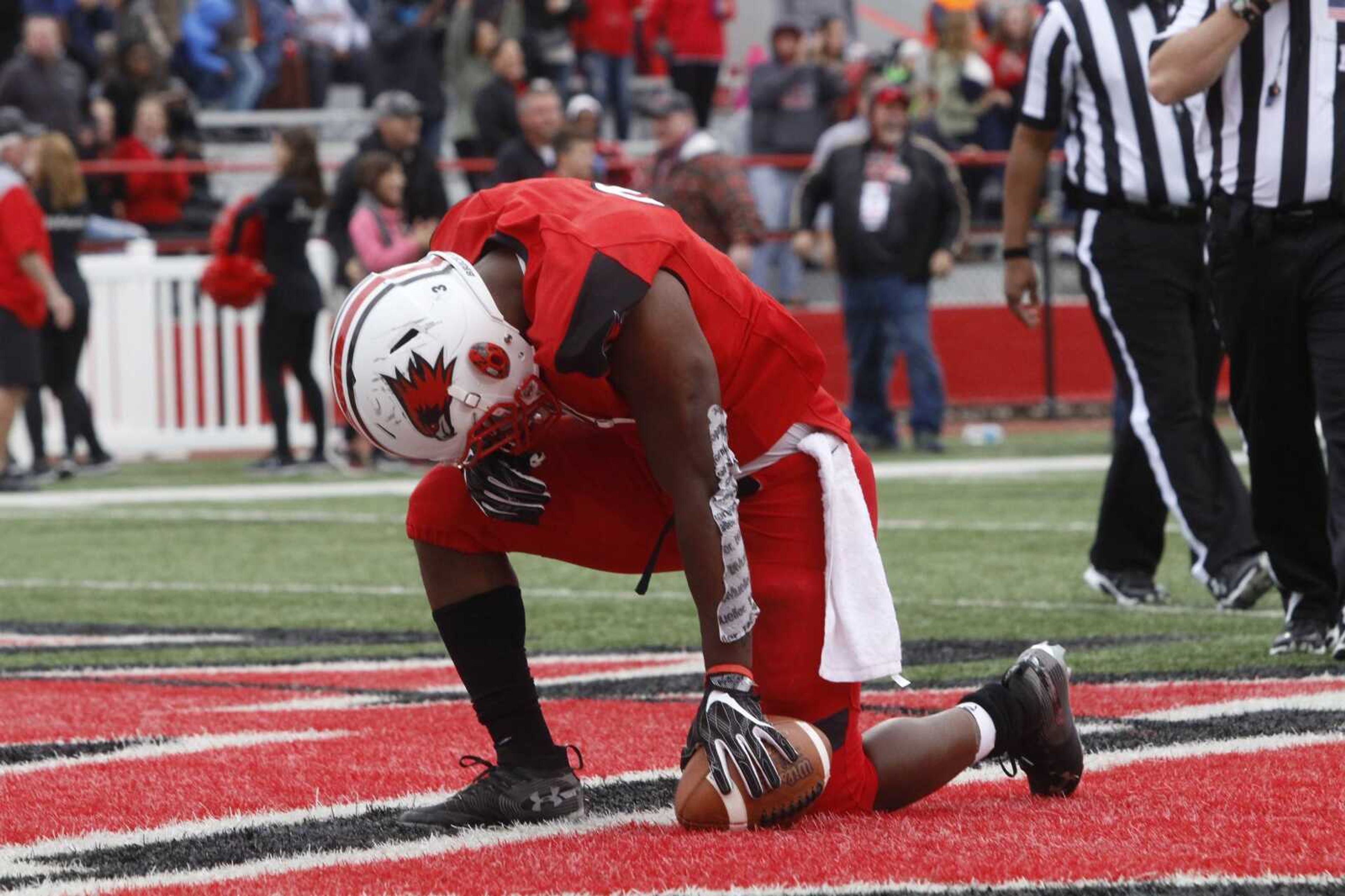 Senior running back Marquis Terry kneels in the end zone after scoring the game-winning touchdown against Austin Peay on Oct. 13.