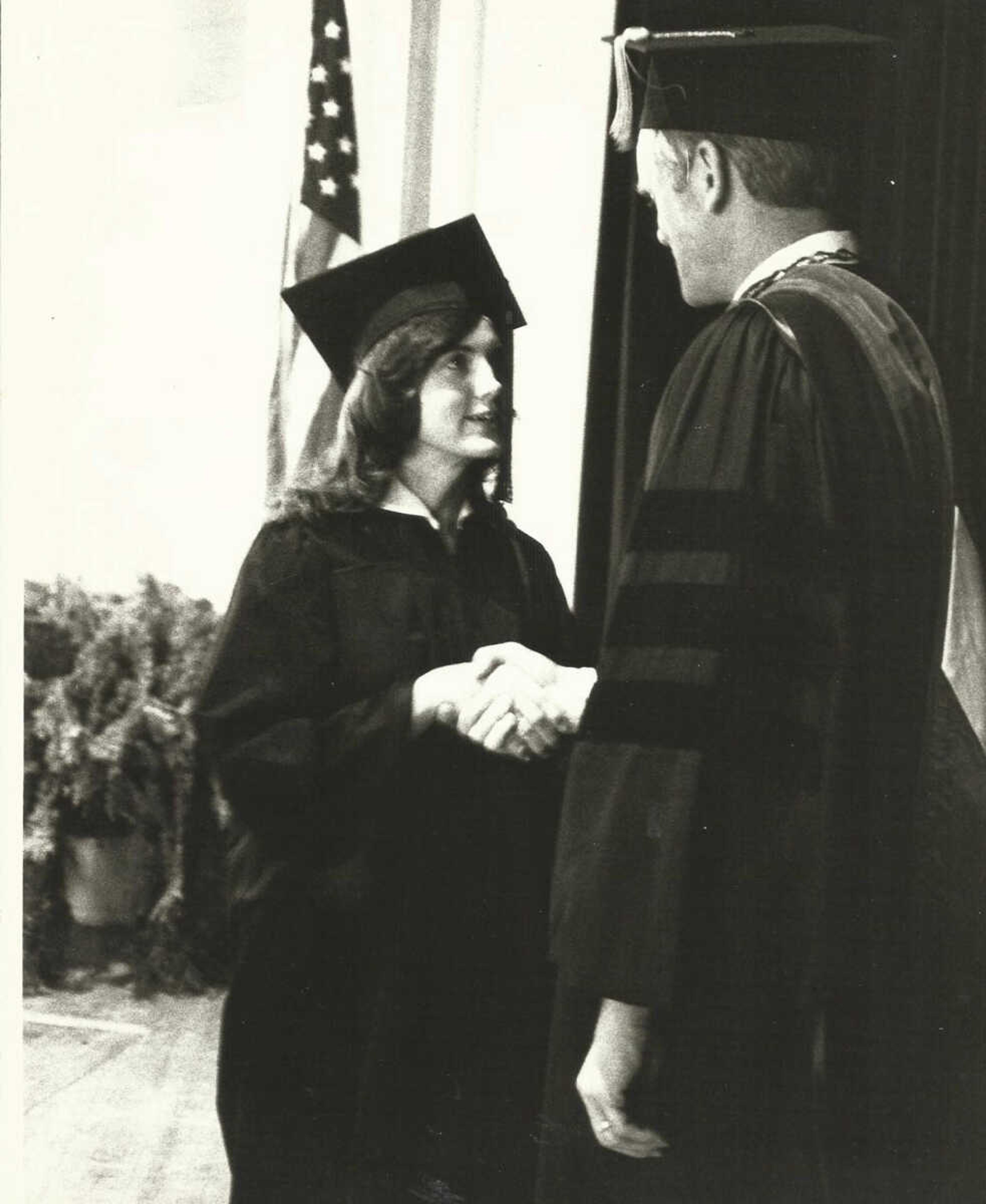<b>Janie Law-Cox shaking hands with the university president Dr. Bill Stacy. </b> Submitted photo