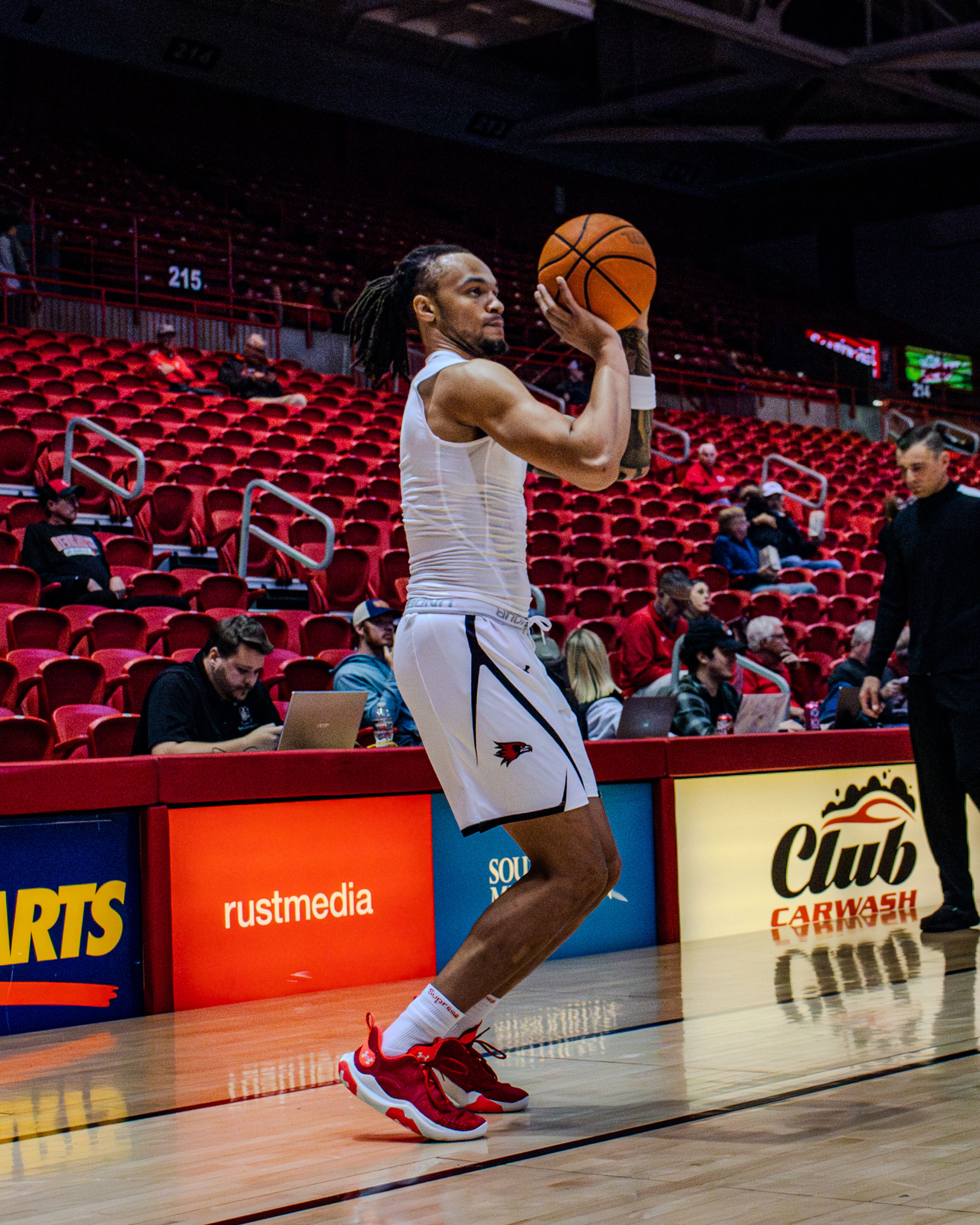 Junior guard Braxton Stacker warms up in pregame against Crowley Ridge College. 