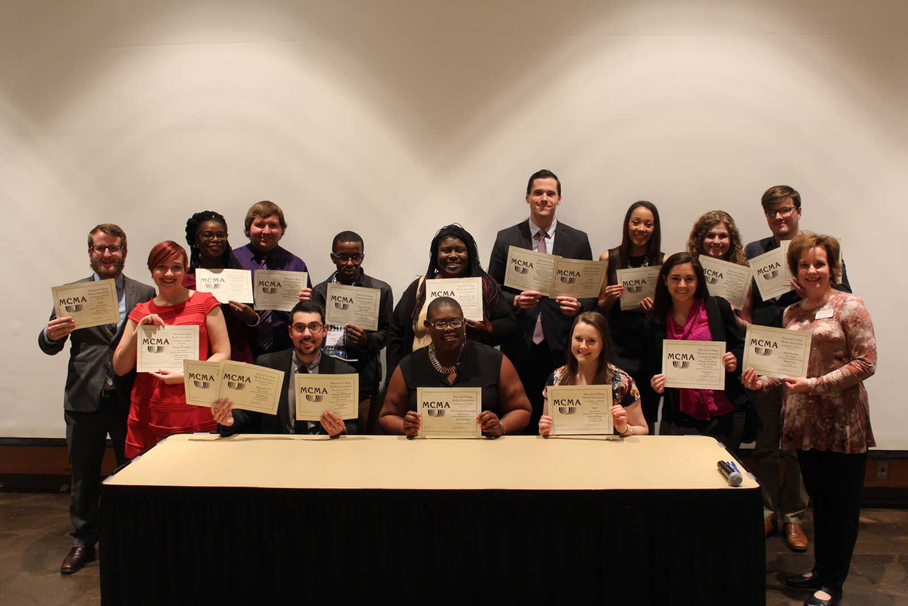 Arrow staff members and advisers pose with all 17 awards they received after the MCMA banquet on April 9.