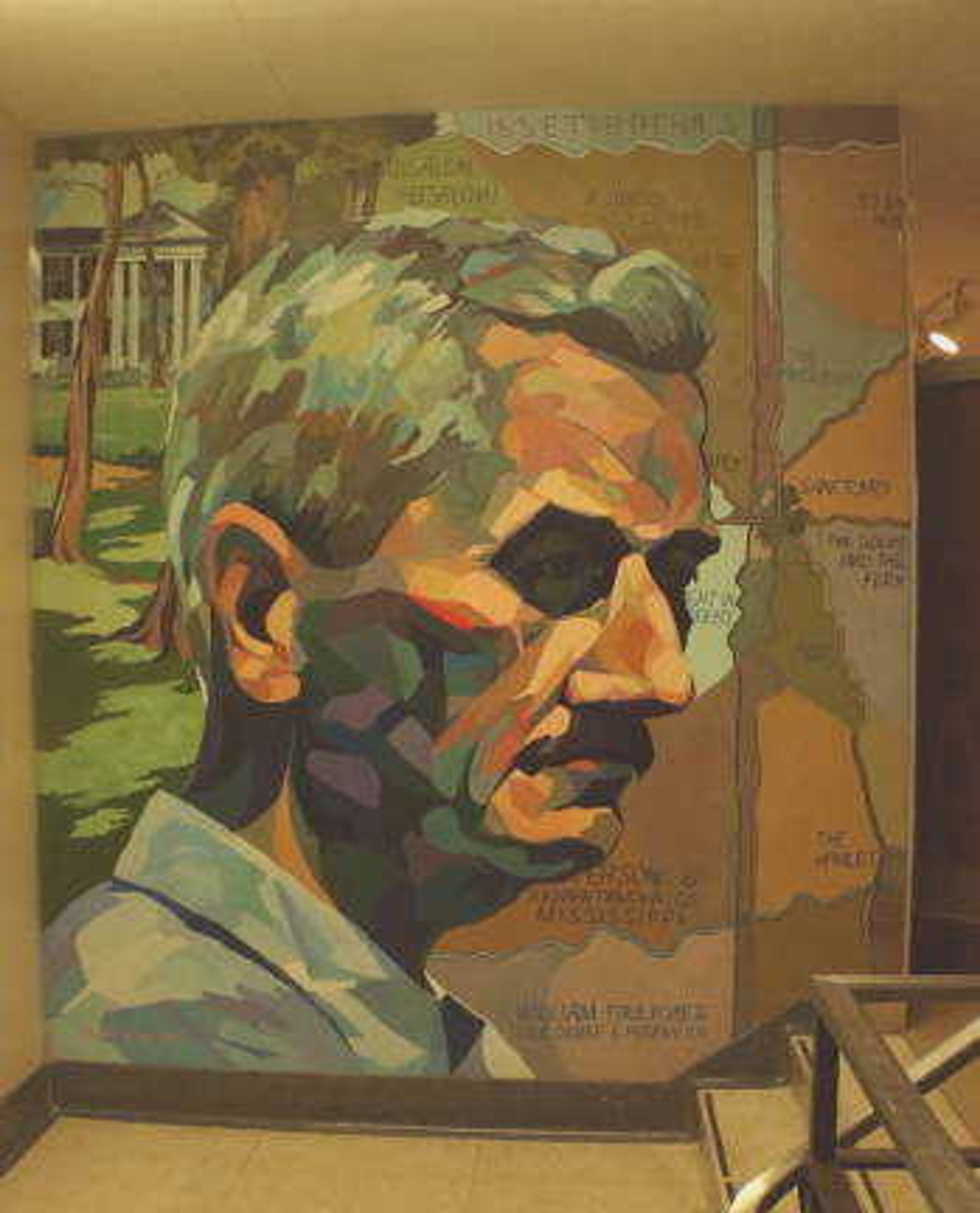 A painting on the wall of Kent Library depicts writer William Faulkner.