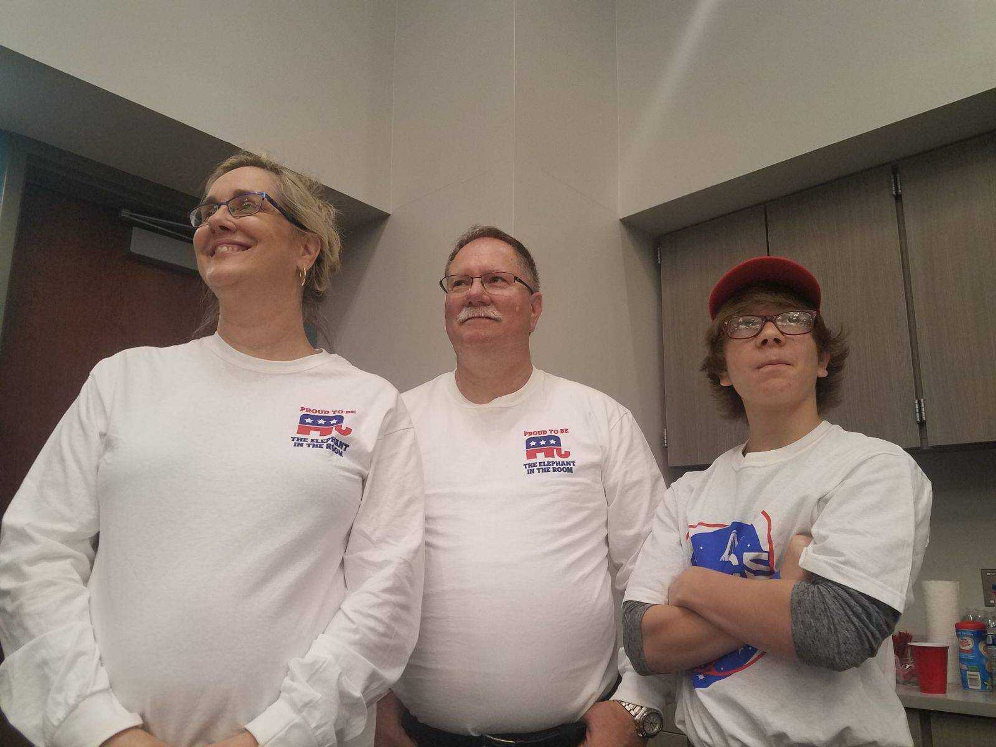 Carolyn Davis, her husband and son watching the midterm elections results come in on Nov. 6.