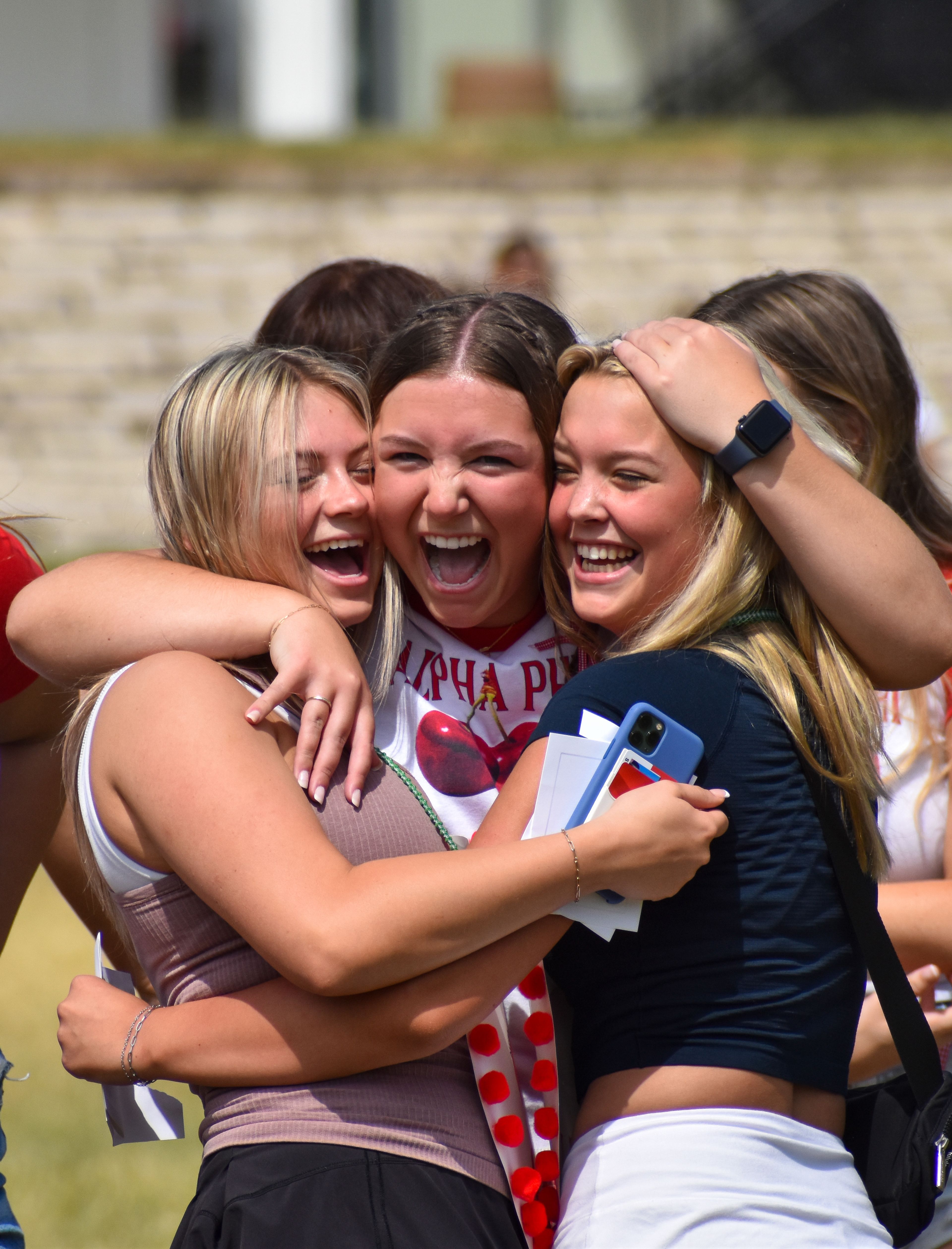 Members of Alpha Phi sorority celebrate on sorority bid day.