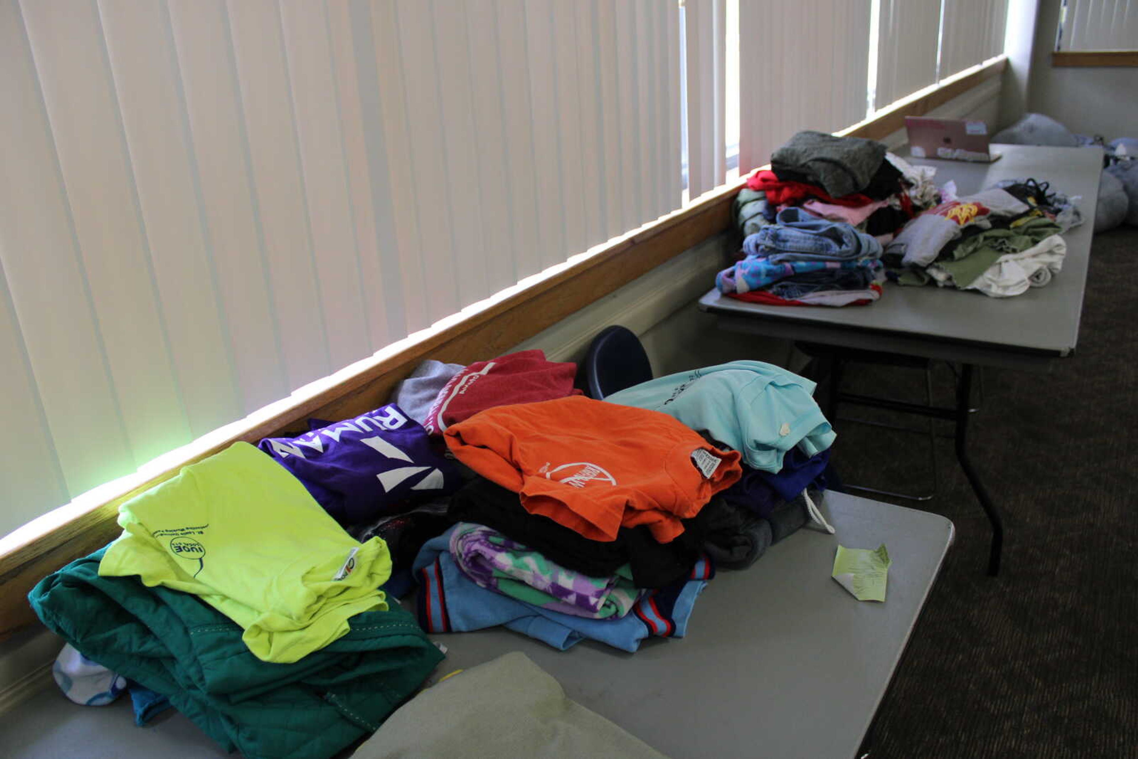Clothes collected by Greek Life sit on tables to be sorted for the Greek Week clothing drive. The clothing drive ran on Thursday, April 20, from 8:30 a.m. to 3 p.m. and had designated time slots for the Greek pairings to drop off their collections of clothes.