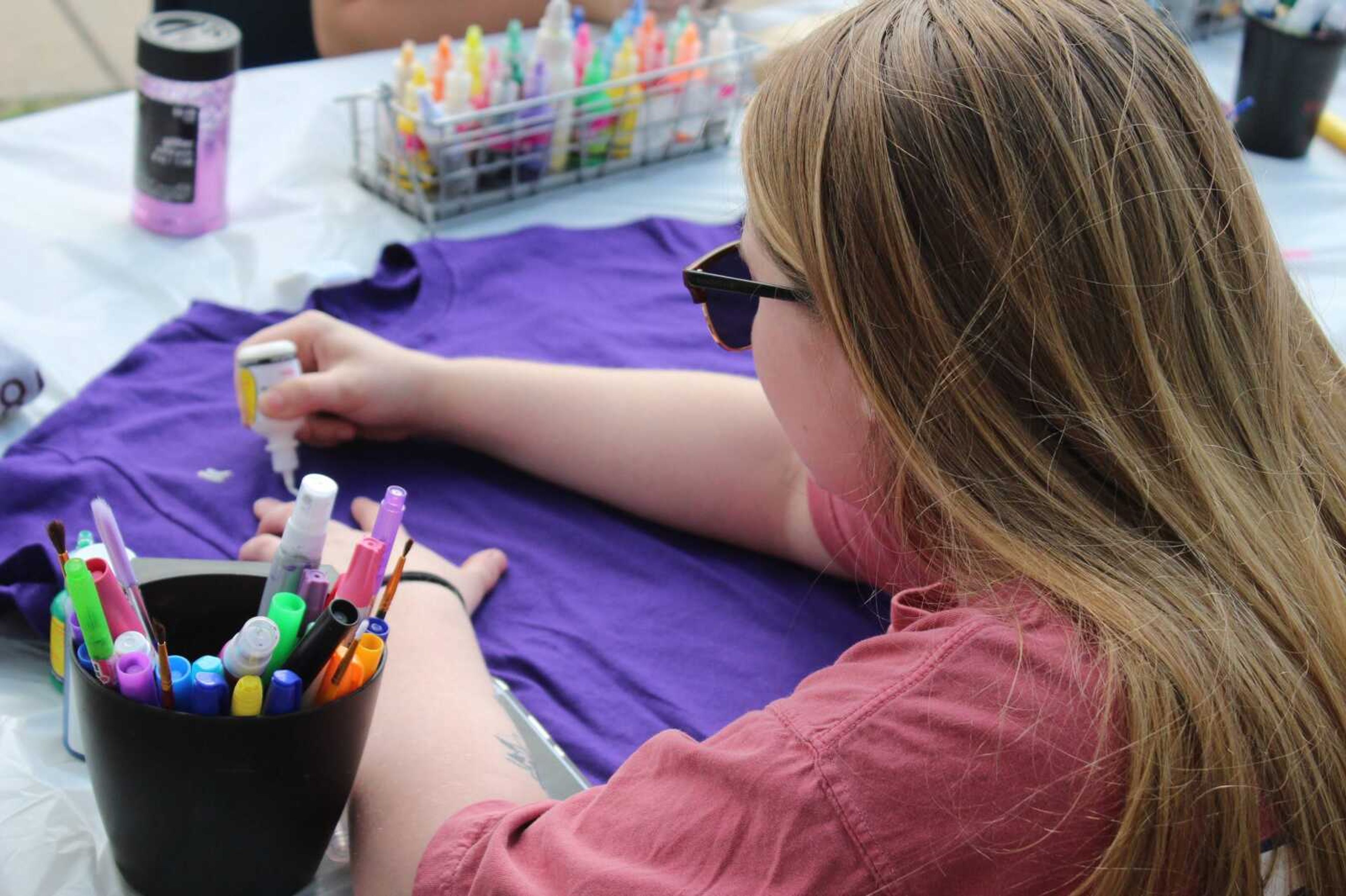 Southeast junior Rachel Rigney designs a T-shirt at the Clothesline Project on Oct. 3. on campus. Redhawks Rising, Redhawk Health Educators and the Campus Violence Prevention Program were sponsors of the event.