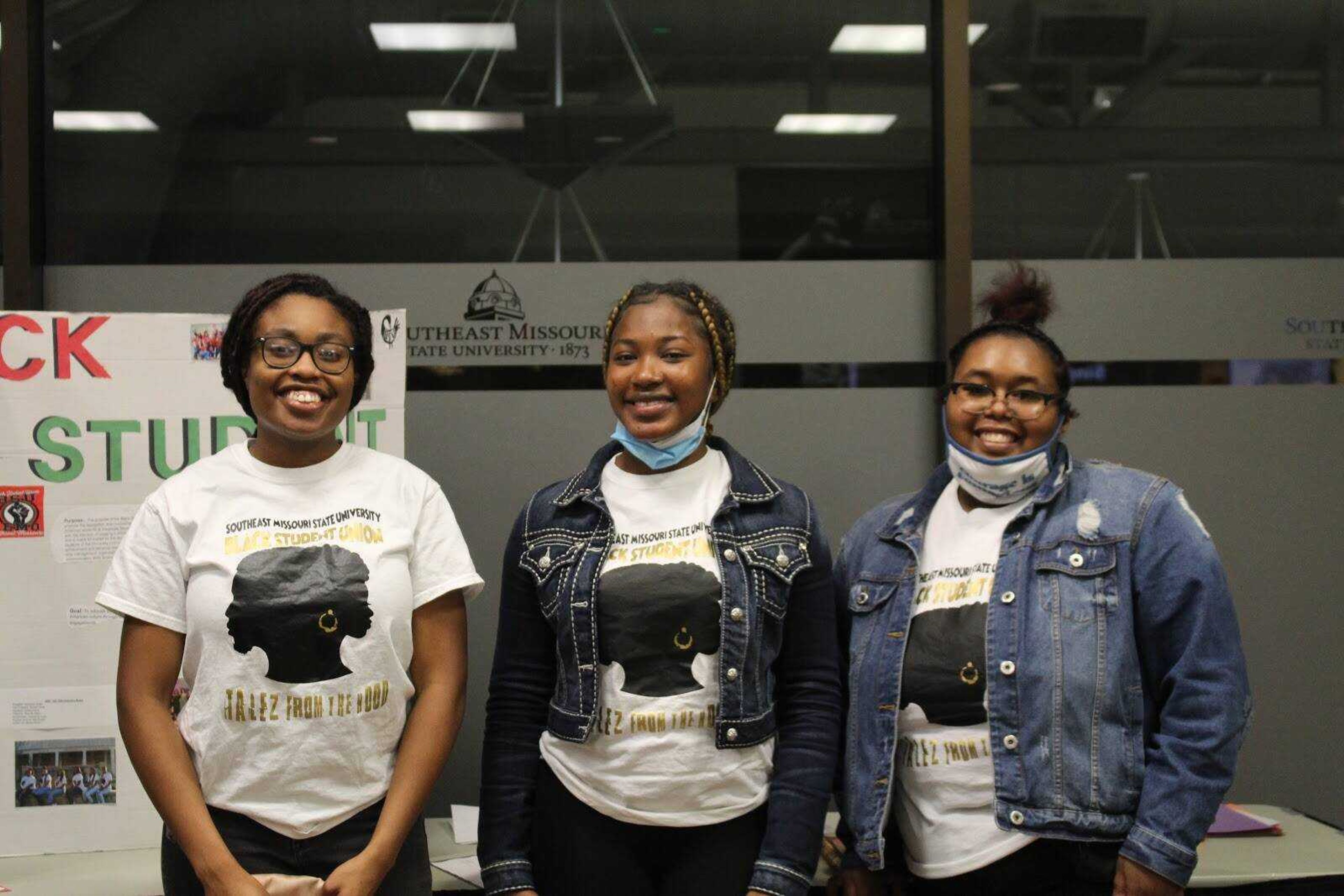 Secretary Jessica Pierre, treasurer Serenity Wilson and president Zambreah Butler, executive members of the Black Student Union, stand in front of their poster advertising the Black Student Union at The University Center on campus. The BSU promotes and recognizes Black and minority voices on campus.