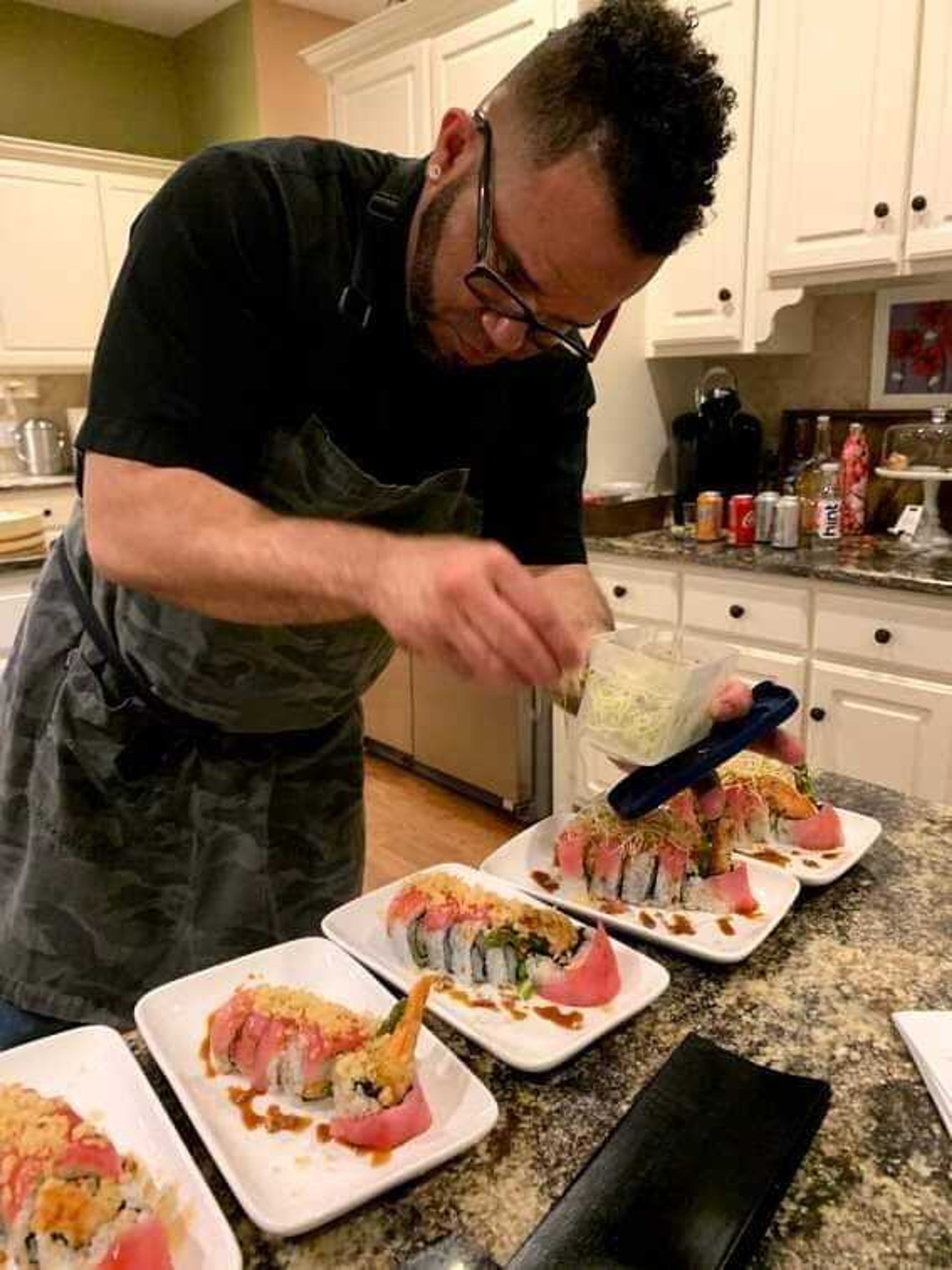 Hospitality Management student Angel Carrasquillo prepares sushi for his business, Sushi by Angel. 