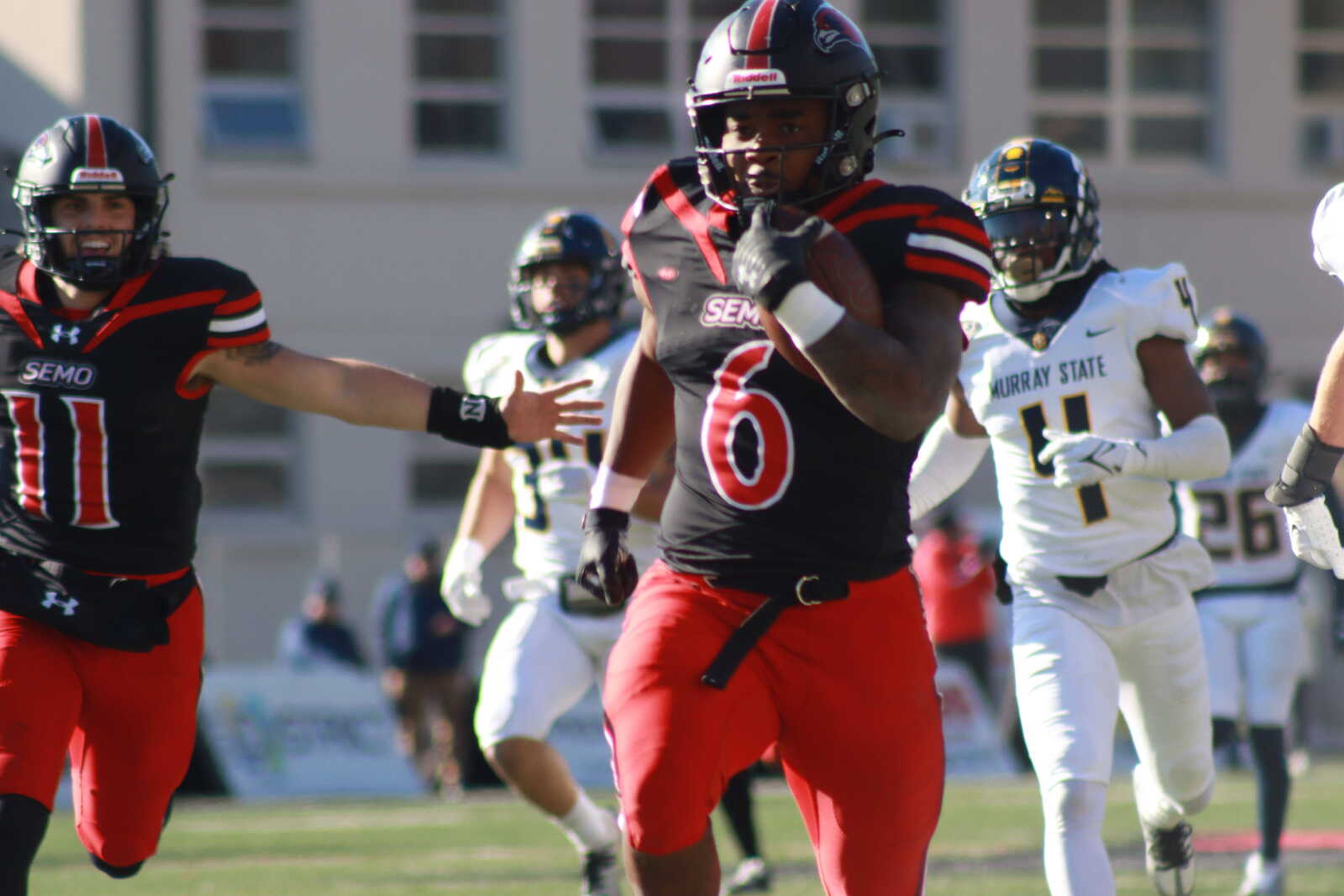 Record breaking senior Geno Hess scores the third touchdown of the OVC Champion game on Saturday, Nov. 19. Hess ran 317 yards and scored four touchdowns to help secure the win for the Redhawks.