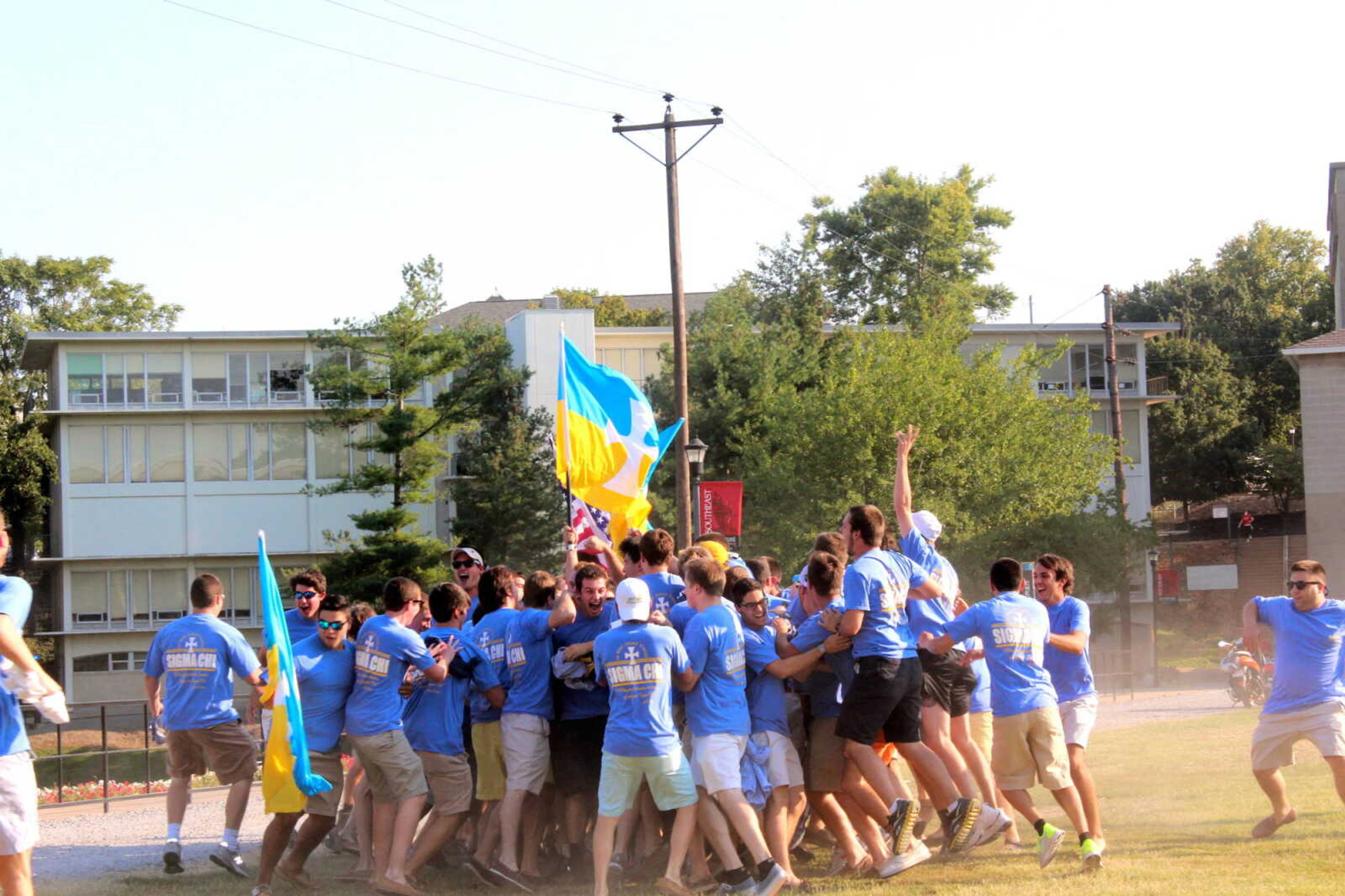Sigma Chi fraternity members meet their new pledges on Bid Day, Sept. 6. Photo by Jami Black