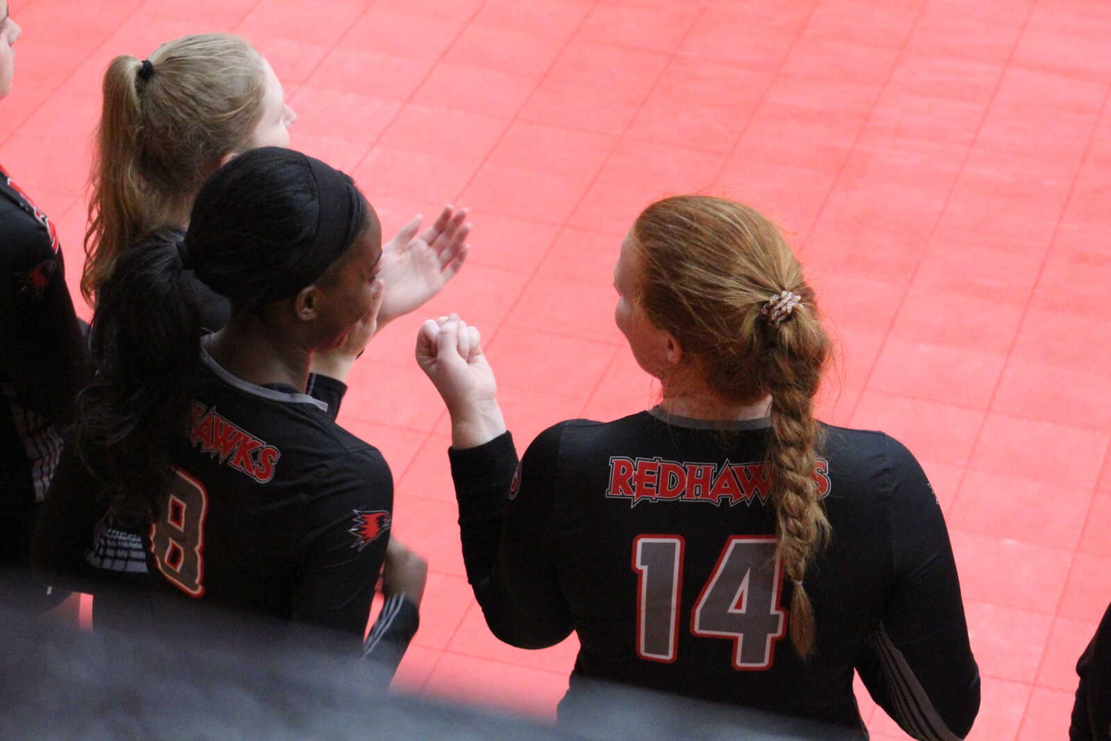 Talia Gouard (middle) stands with her teammates during a match at Houck Fieldhouse in Cape Girardeau.
