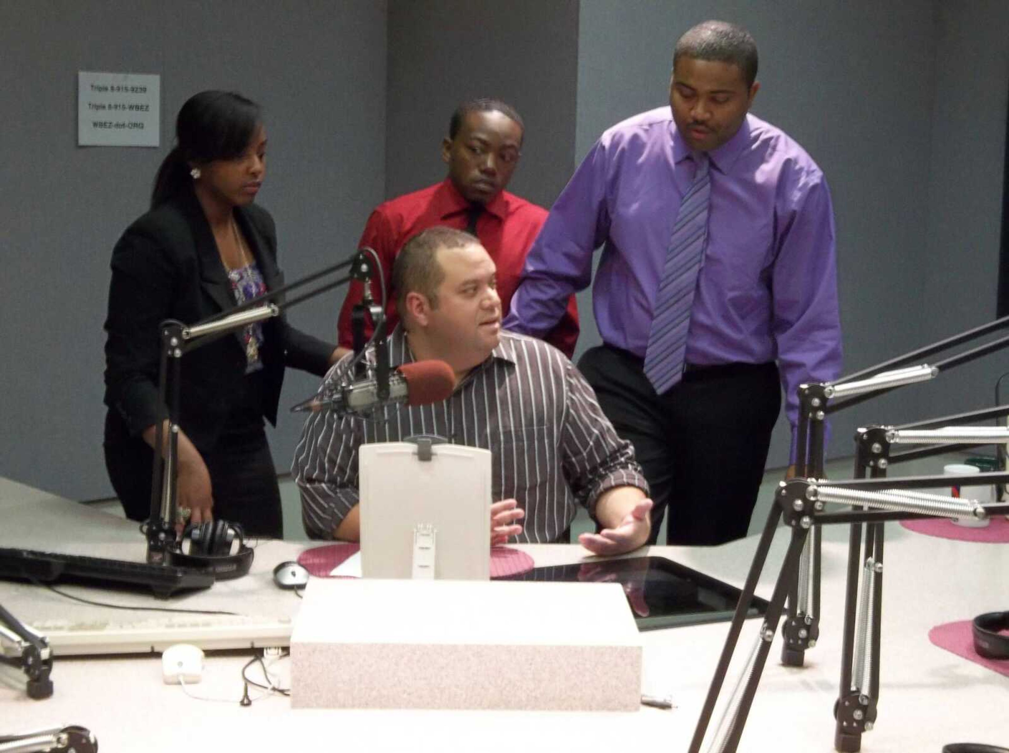 NABJ students Casandra Lenoir (left), Reginald Whitted (middle) and Deon Fisher (right), visited a local Chicago radio station on their trip.
