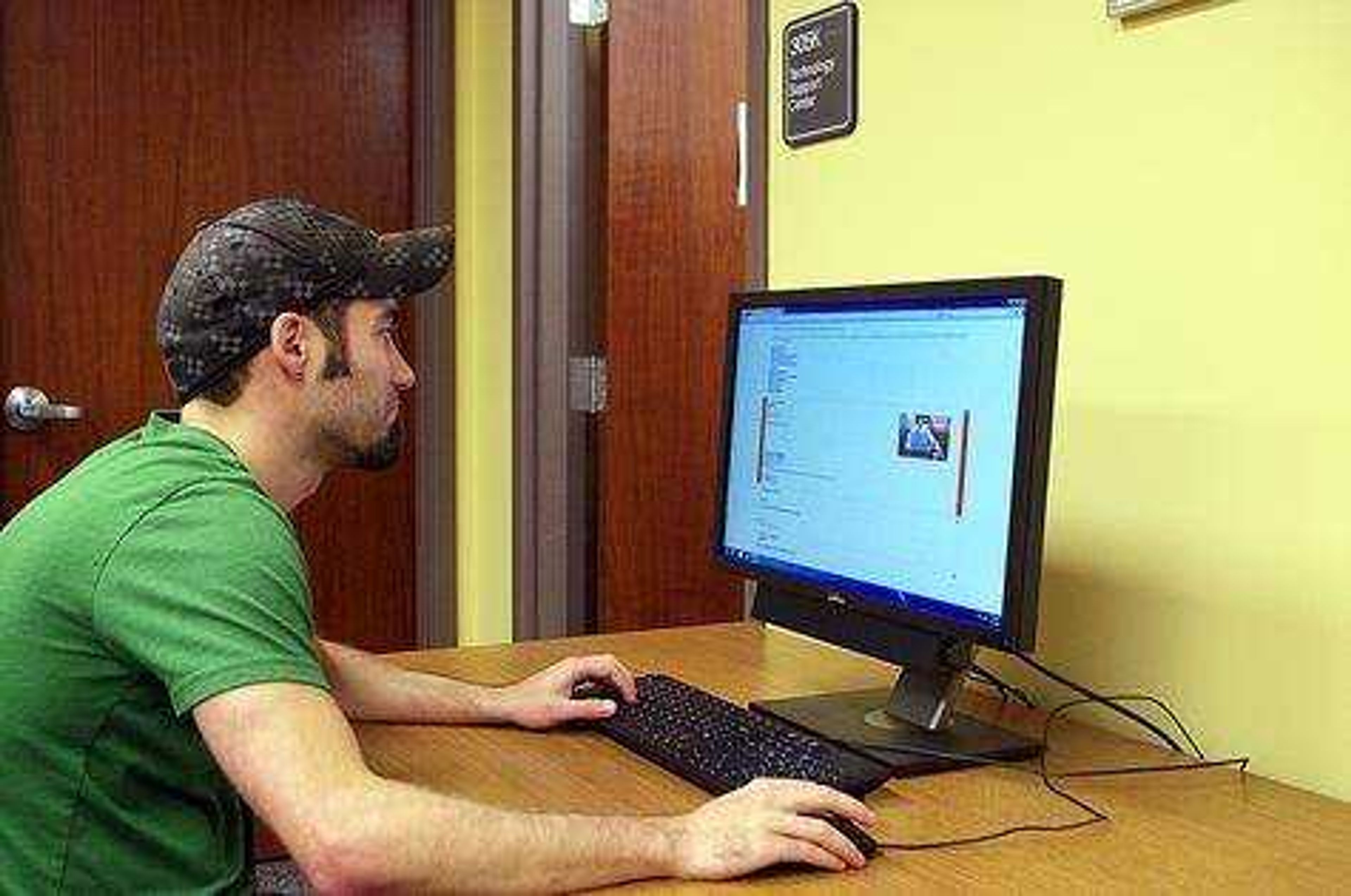 Andrew Schmid uses Southeast's new learning system Moodle at Kent Library. Photo by Nathan Hamilton