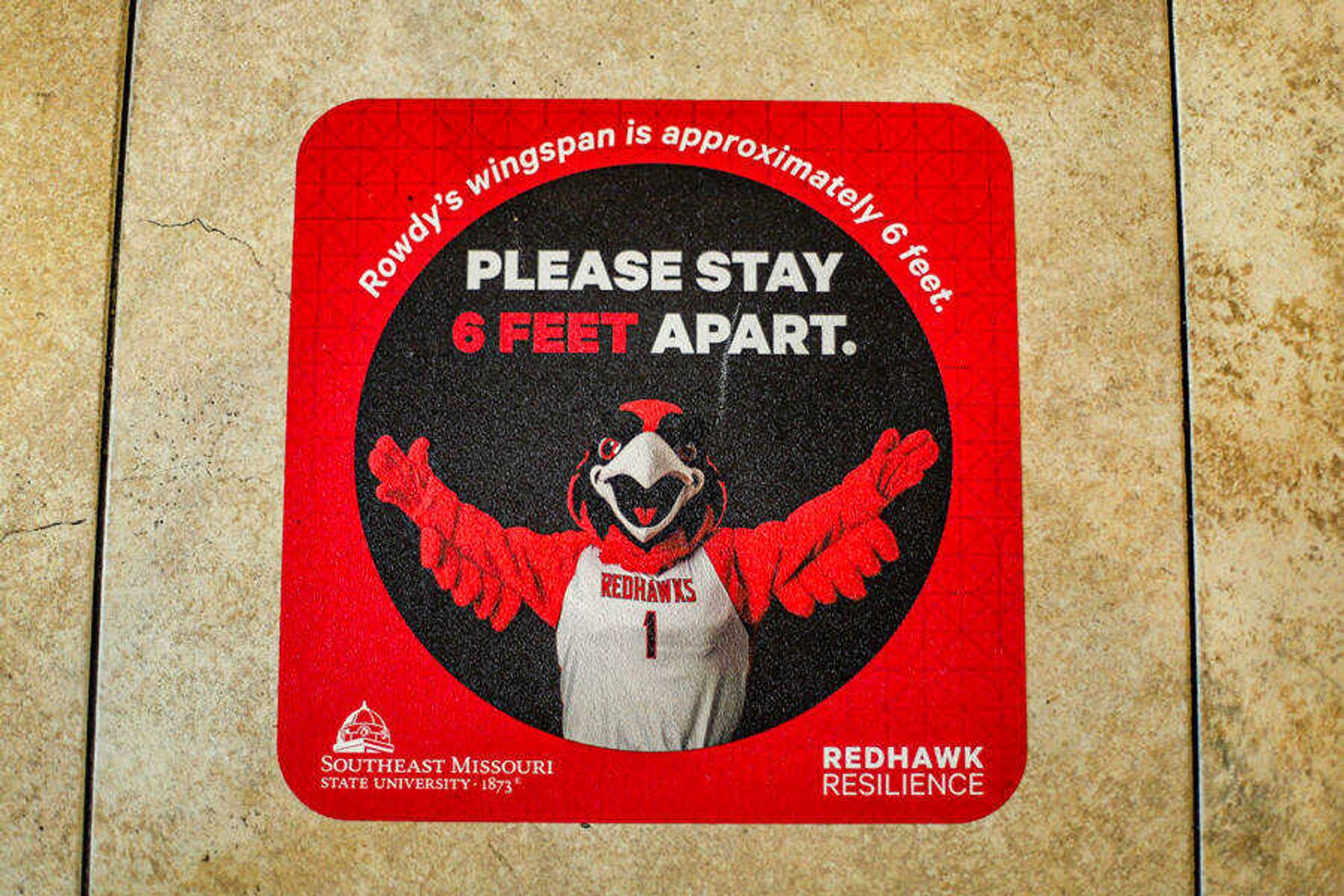 Decals have been added to the floor of many campus locations to guide students in social distancing in public.