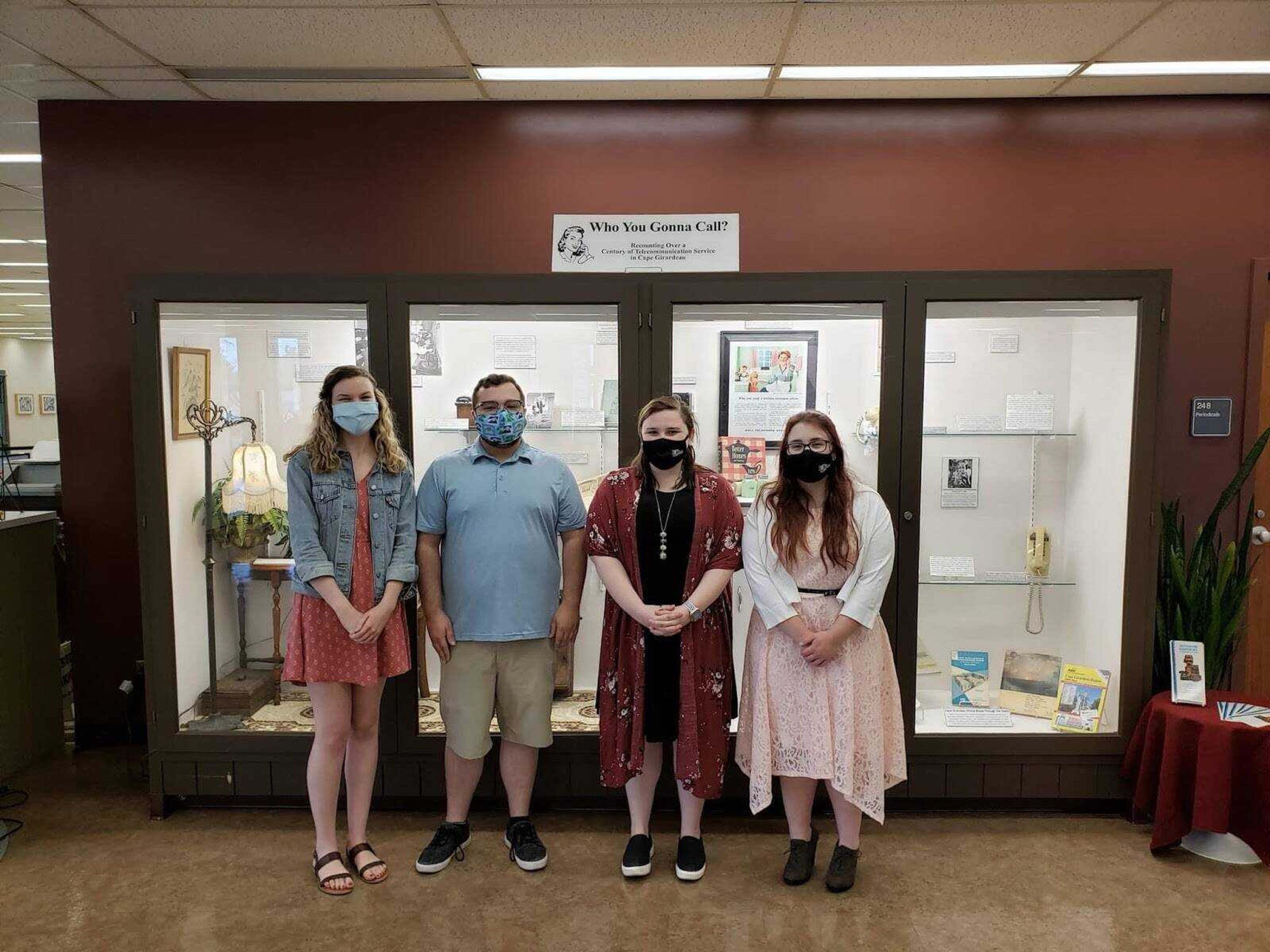 (From left) Lakin Fraker, Peter Reckling, Kaitlyn Barnett and Allyson Ingli at the unveiling of the student-designed historical exhibits in Kent Library. 
