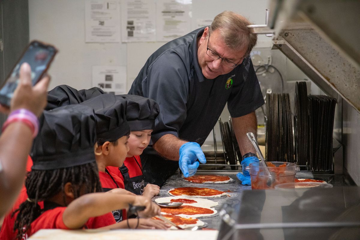 Pizza time: Restaurant owner gives Cub Scouts a hands-on les...
