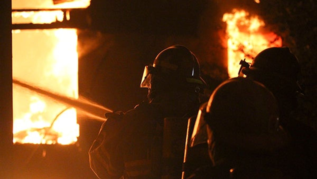 Fighters battle blaze at condemned apartment complex